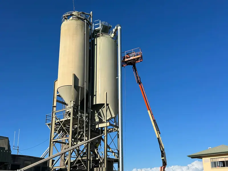 Silo dust extraction ducting installed from elevated work platform